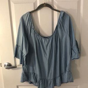 Off the shoulder, light denim shirt
